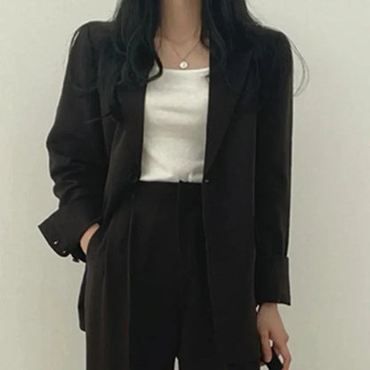 Kvinders Jakkesæt med Oversize Blazer og Højtaljede Bukser 10